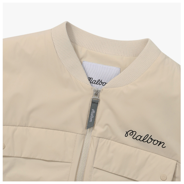 Malbon women's lightweight cargo windproof golf vest in Beige, collar and logo detail