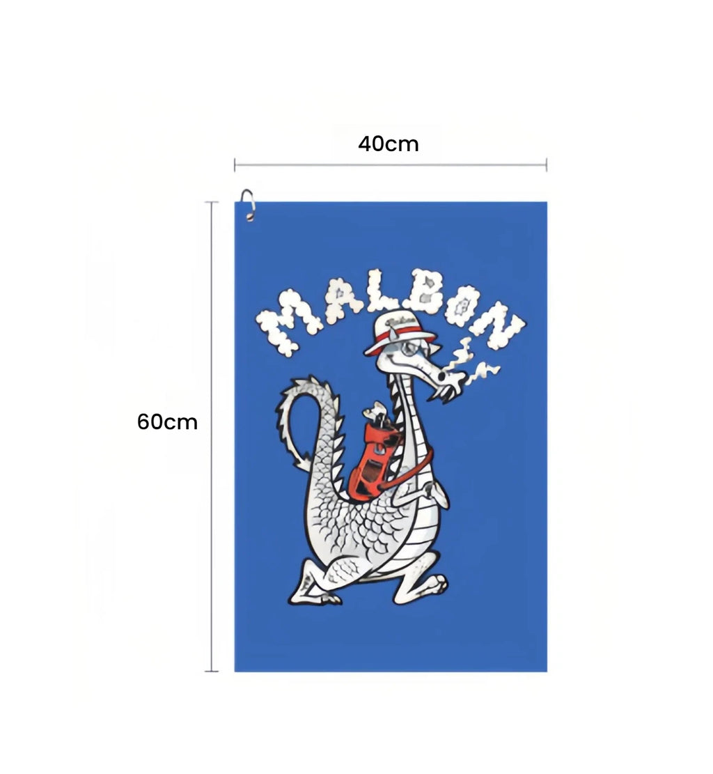Malbon Limited Edition 2026 Golf Towel with Clip — clipped to a golf bag