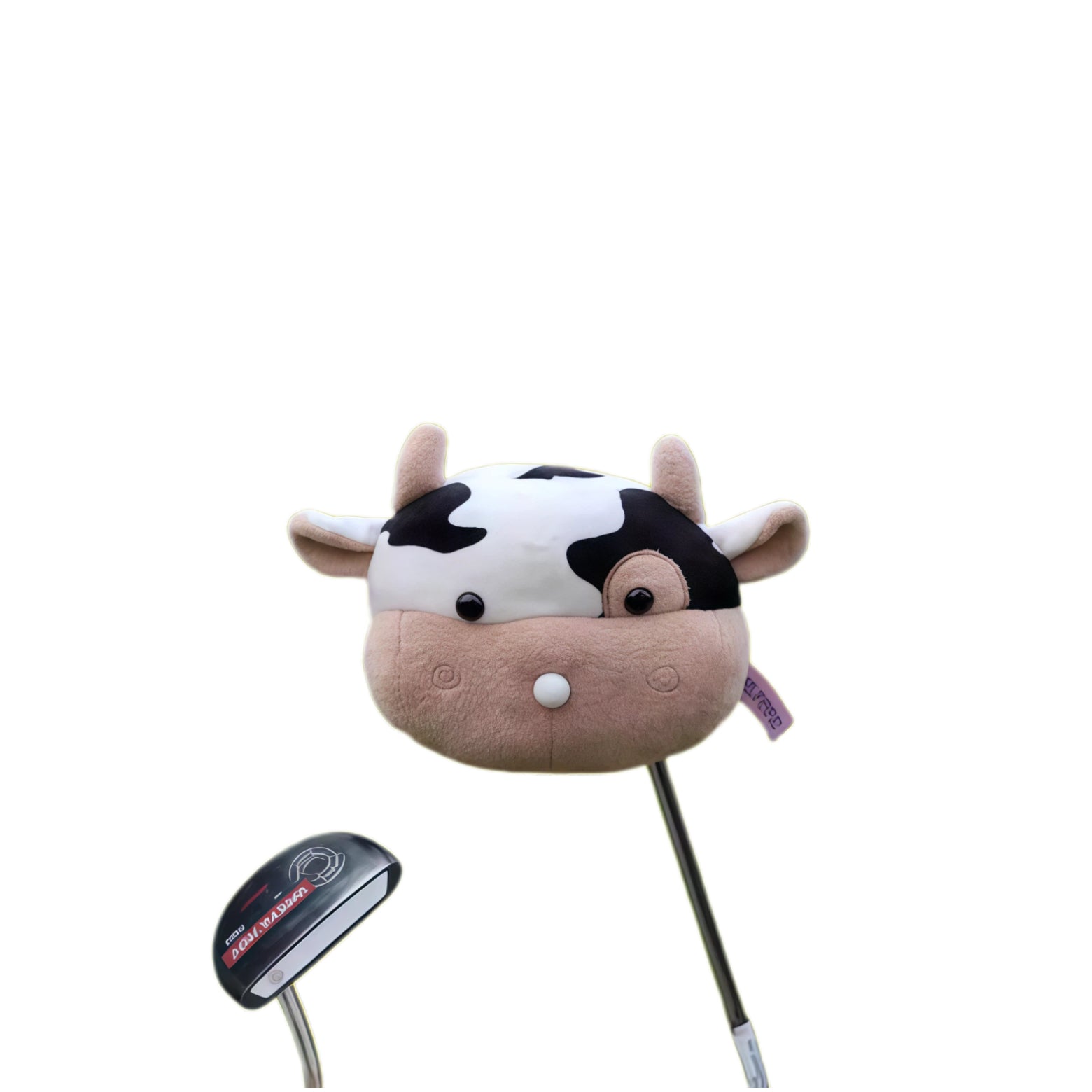 Cow plush golf driver headcover seen from above, fitted snugly over a black mallet putter for size comparison