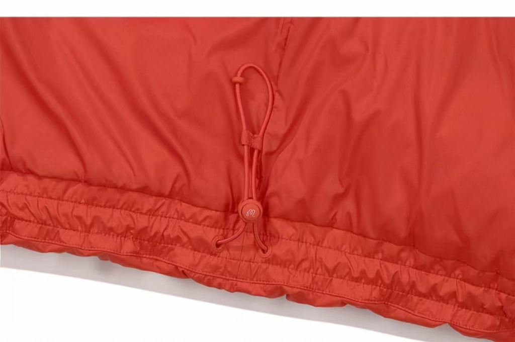 Malbon Golf Women’s Lightweight Thermal Down Vest orange hem drawcord detail
