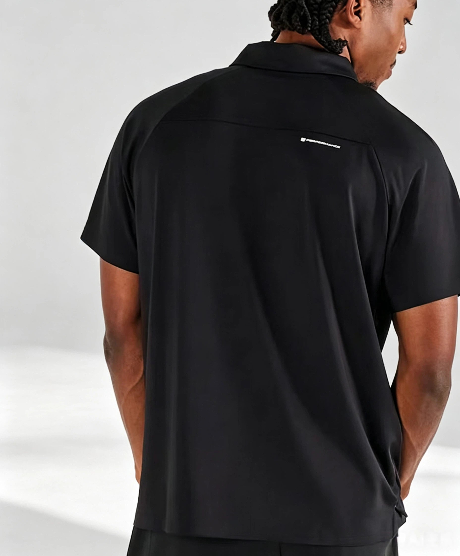 Malbon men's quarter-zip golf polo shirt in Black, logo and fabric detail