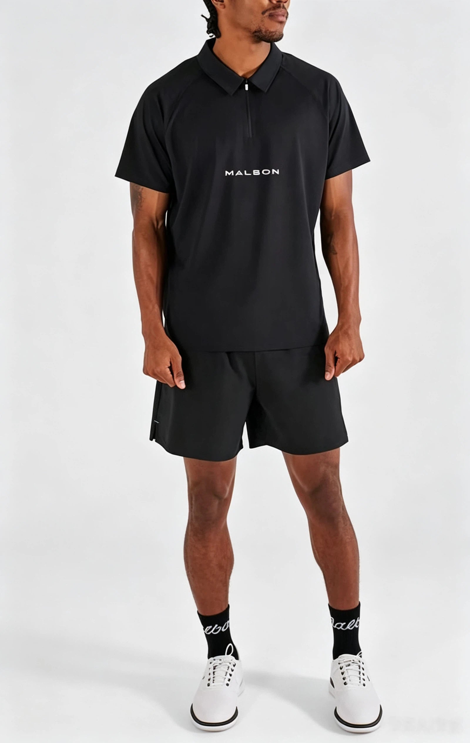 Malbon men's quarter-zip golf polo shirt in Black, back view