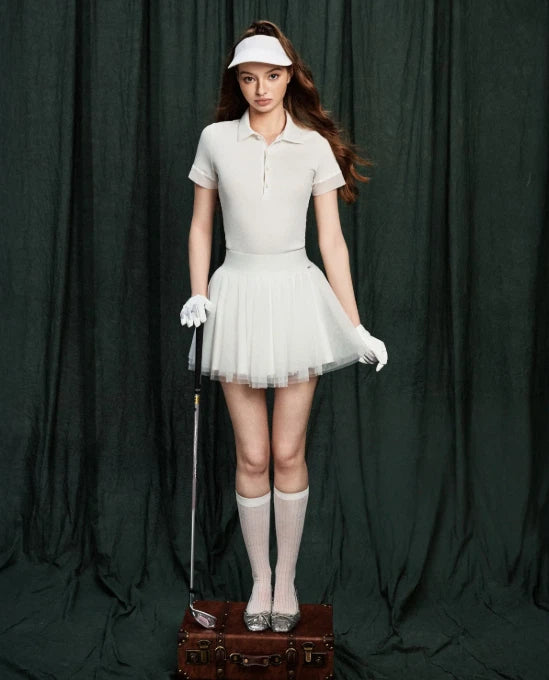 NowRose White golf polo and pleated skirt model front view