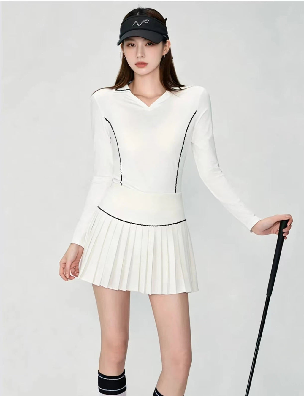 OZERO White golf shirt and pleated skirt set front view on model