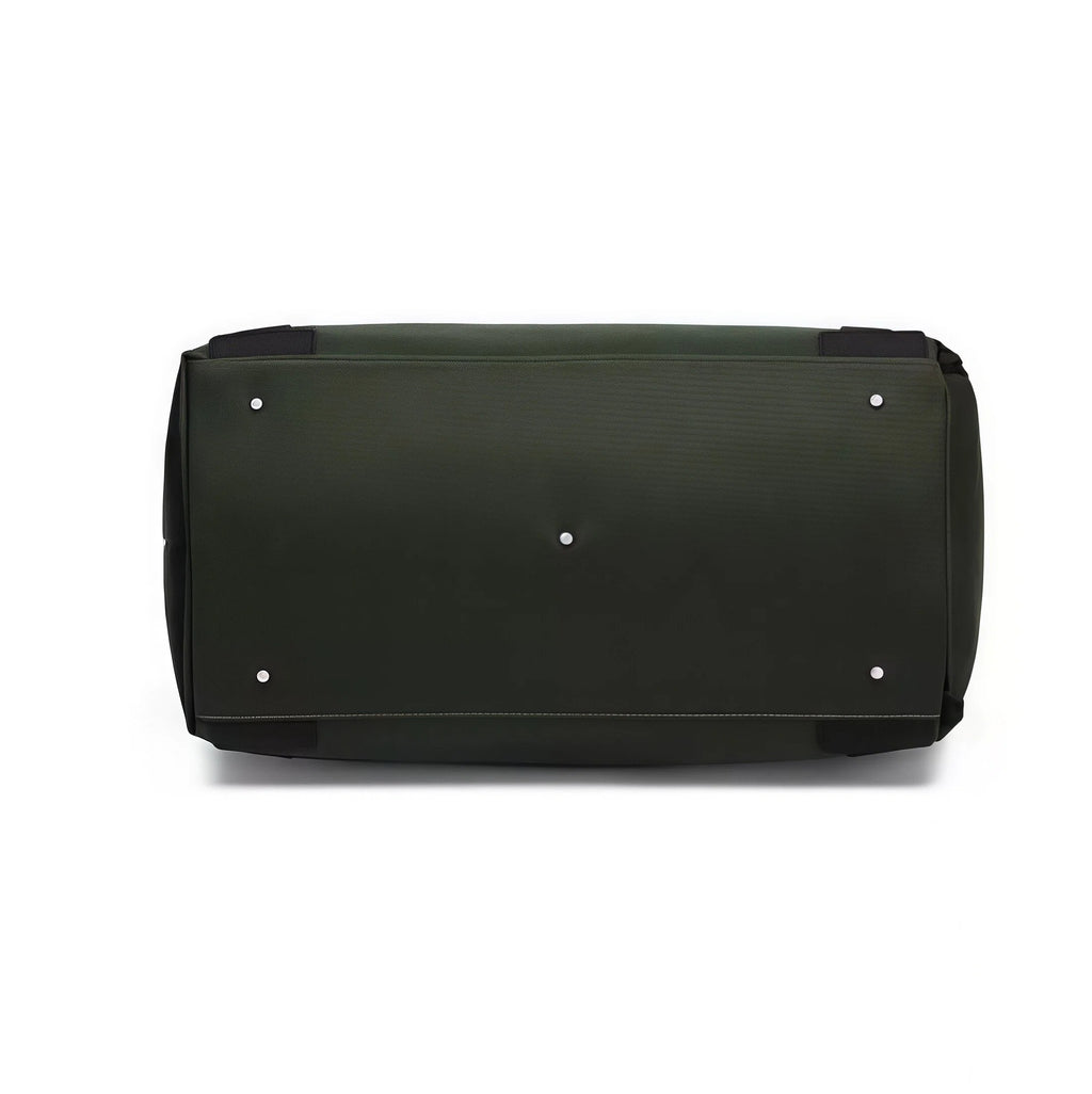 Bottom view of the PGA Official Golf Duffel Bag showing four silver protective feet and reinforced stitching for added durability and protection against wear.
