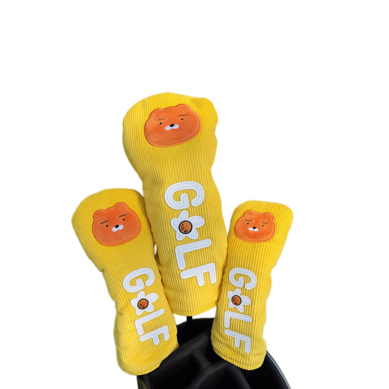 Three yellow socks with bear face designs and 'GOLF' text on a white background