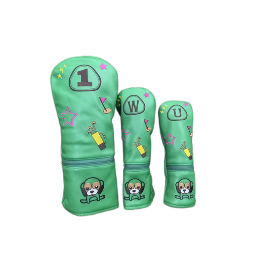 Cartoon puppy golf headcovers set in green featuring embroidered puppy face, stars, golf bag and flag icons, with zipper pocket for storage, compatible with driver, fairway and utility clubs.