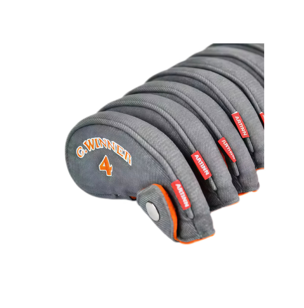 Set of gray golf club heads with branding on a white background