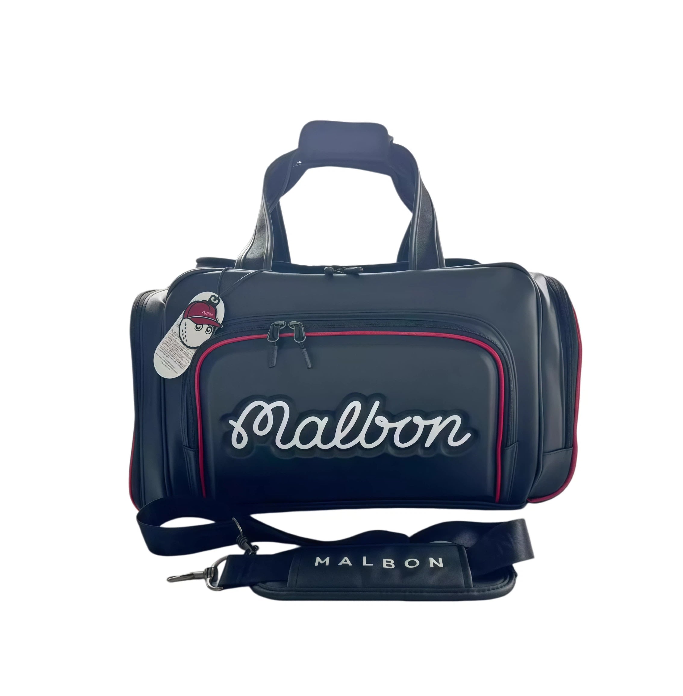 Front view of the Malbon Golf M Bucket Boston Bag in navy blue with red trim. Features a raised white "Malbon" script logo, dual zippers, top handles, and detachable shoulder strap. Includes branded tag with cartoon golf ball mascot.