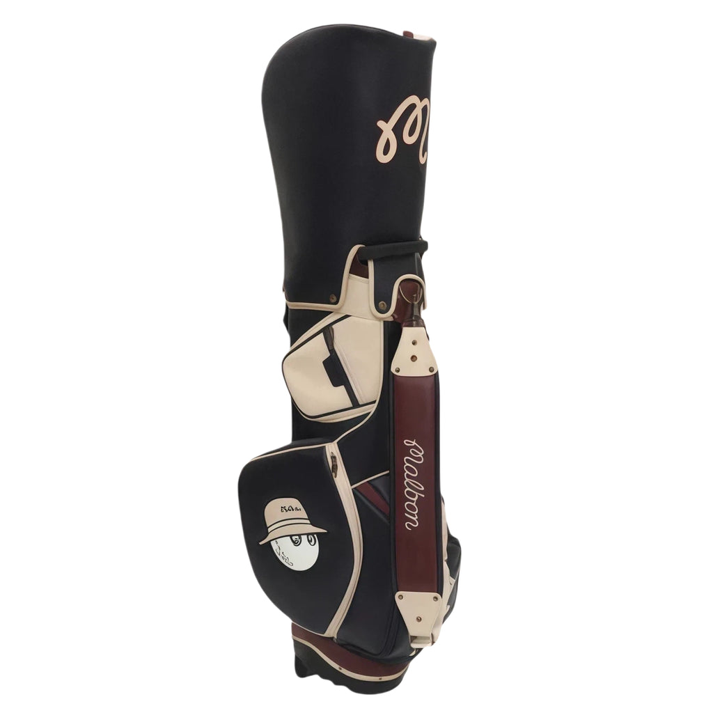 Back view of Malbon Golf stand bag highlighting the cartoon golf ball character wearing a hat, zippered pockets, and durable construction with cream and brown detailing.