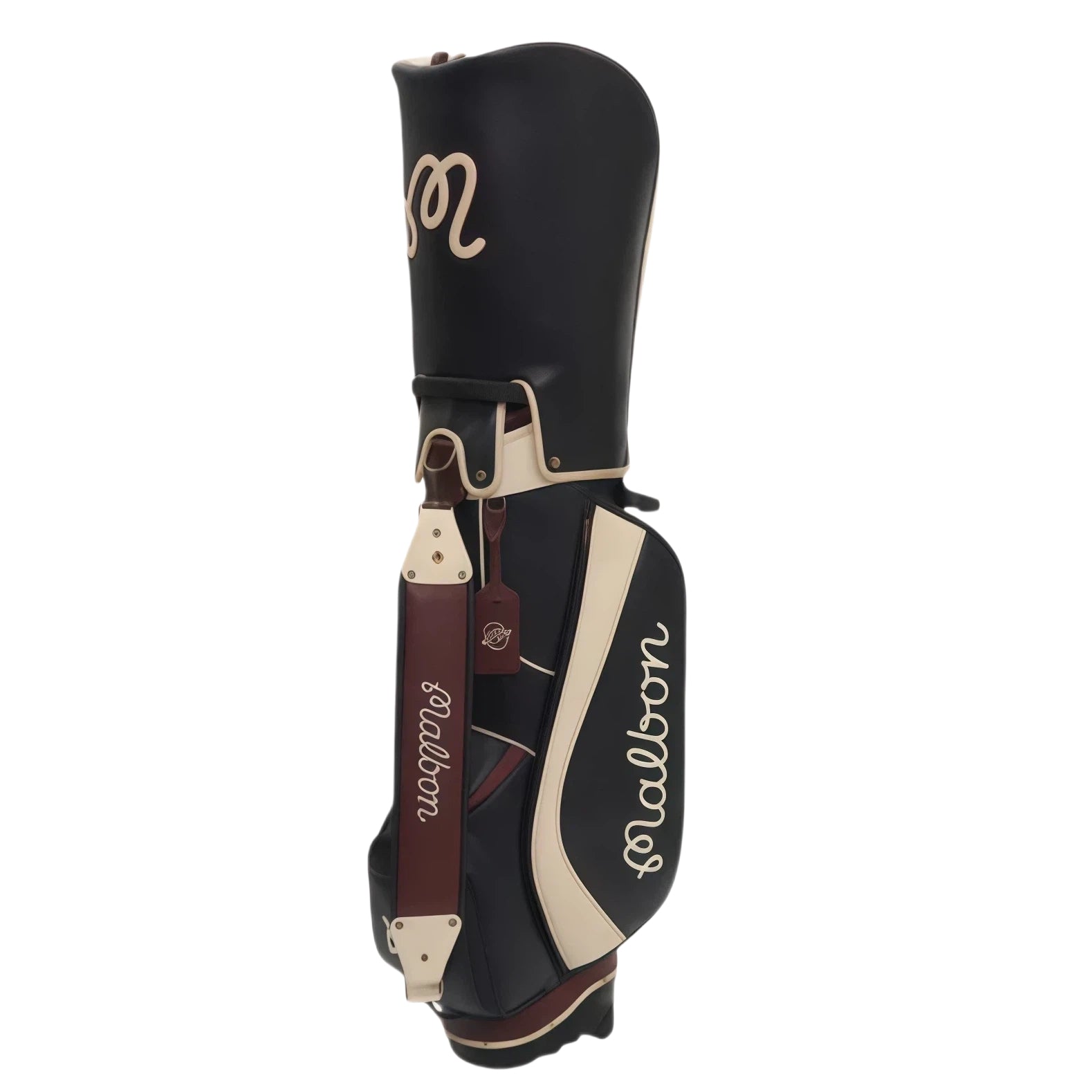 Front view of Malbon Golf stand bag in black PU leather with cream trim, showing the "Malbon" script logo, brown shoulder strap, and vintage-style tag with brand emblem.