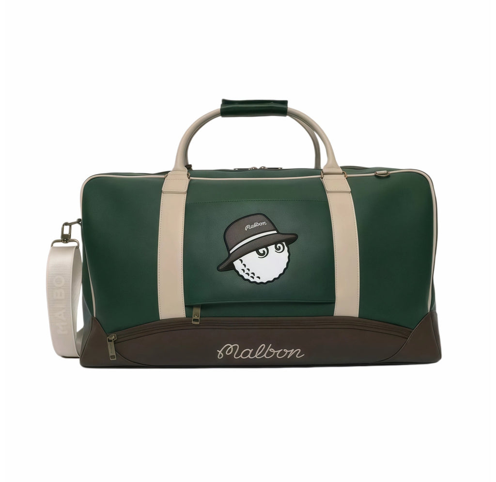 Front view of Malbon Golf two-tone duffle bag in forest green with beige straps, cartoon "Buckets" golf ball wearing fedora hat, brown bottom panel, and embossed "Malbon" script