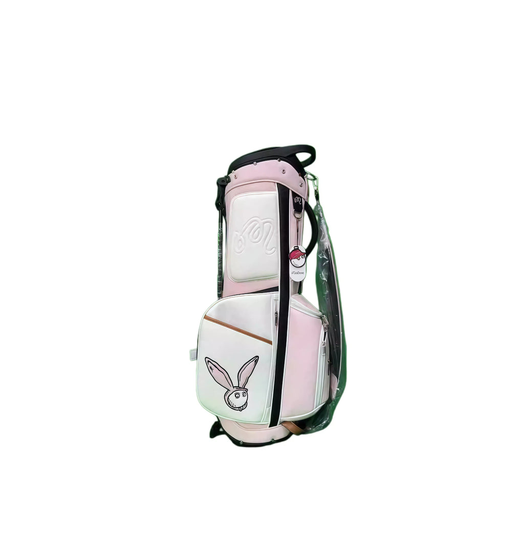 Malbon Pink Golf Stand Bag back view in white and pink with cartoon rabbit and “Malbon” script embroidery - spacious interior, reinforced stitching, and durable design for everyday golf travel