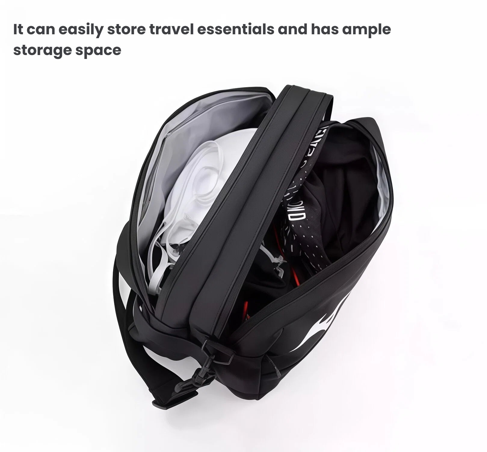 Top-down open view of the Mizuno Black Crossbody Bag displaying generous storage capacity filled with travel essentials including folded clothing, accessories, and small electronics, demonstrating practical organization for commuters, travelers, or athletes.