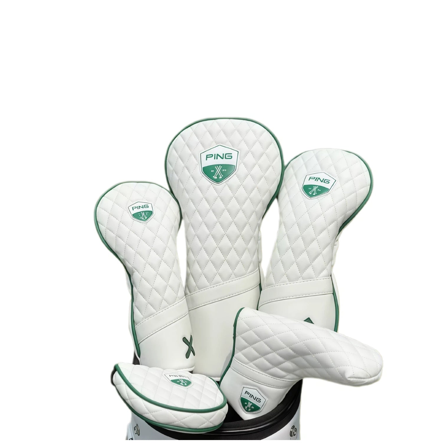 Ping Masters golf headcover set featuring driver, fairway woods, and putter covers with white quilted design and green trim, offering comprehensive protection for golf clubs.