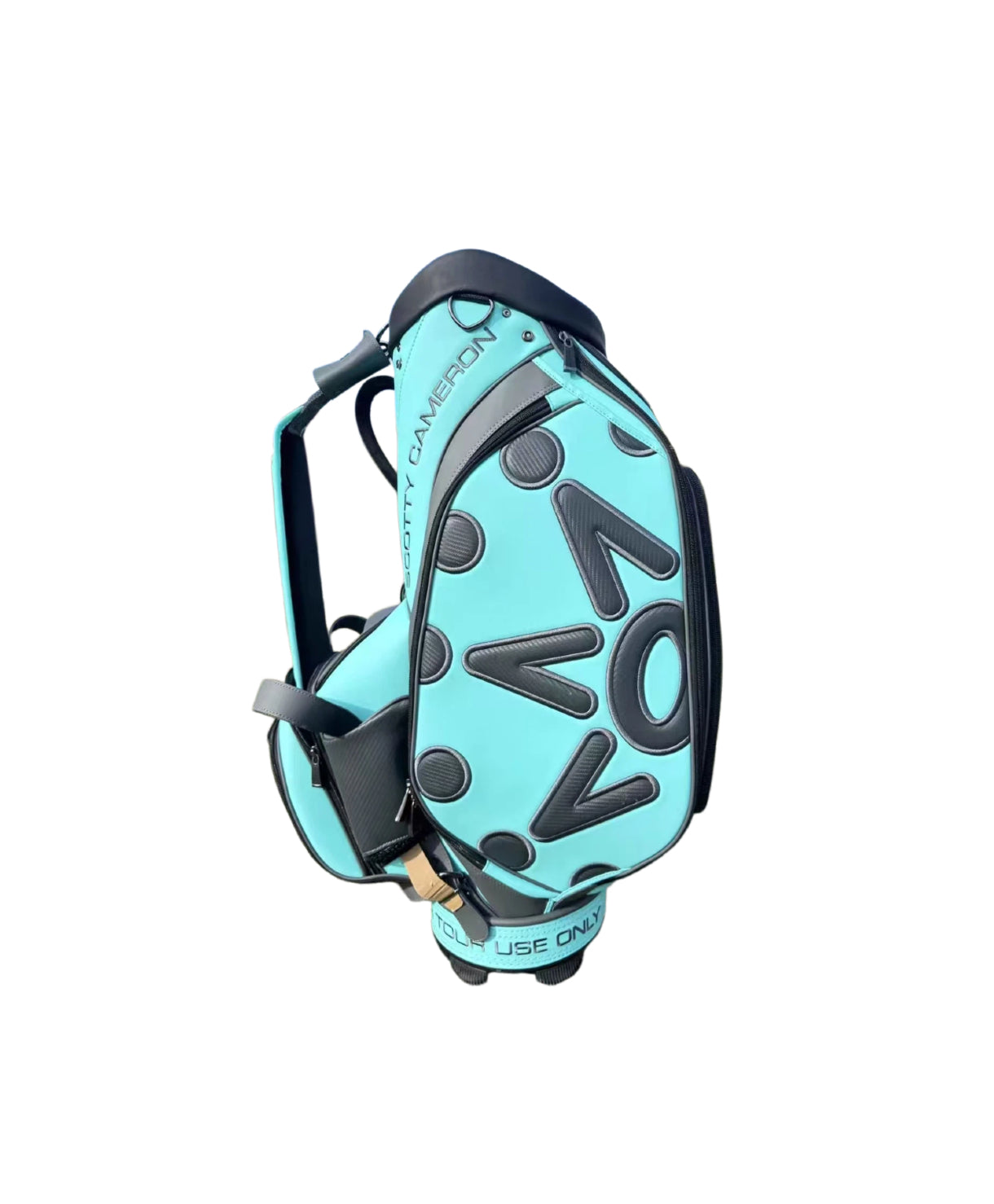 Side profile of the Scotty Cameron Tour Bag showing the unique "NOVO" letter pattern design in black on the Scotty Blue PU material.