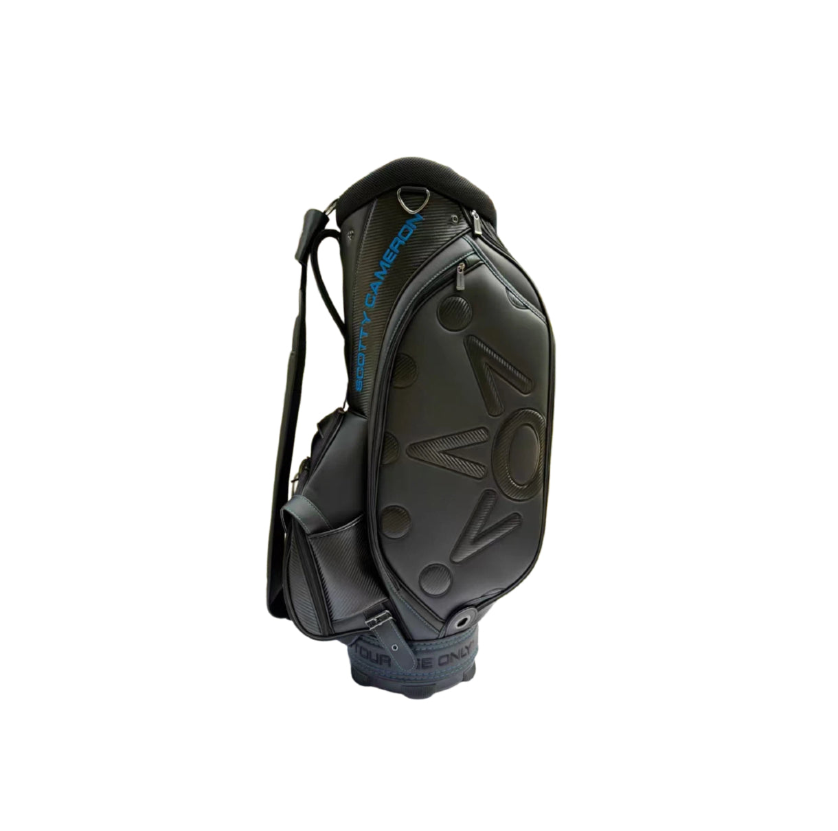 Front view of the Scotty Cameron Backin Black Tour Bag highlighting the large 3D "NOV" lettering, carbon fiber texture details, and blue accent stitching.