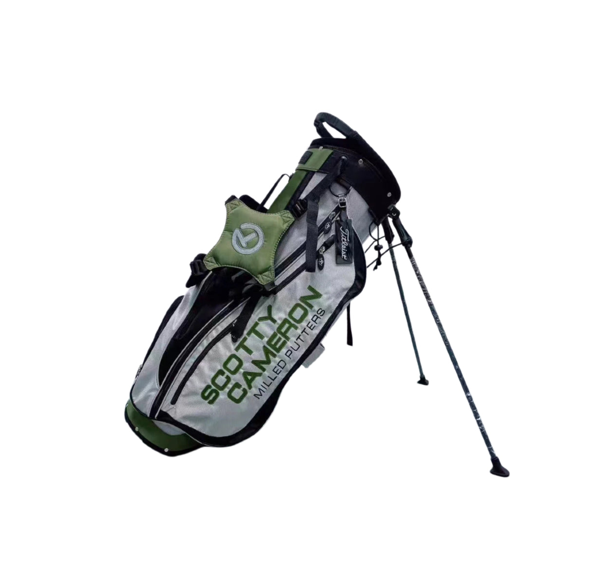 Side profile of the Scotty Cameron Pathfinder Golf Stand Bag in Gray/Green, highlighting the "SCOTTY CAMERON" branding, Titleist tag, and durable construction with integrated stand legs.