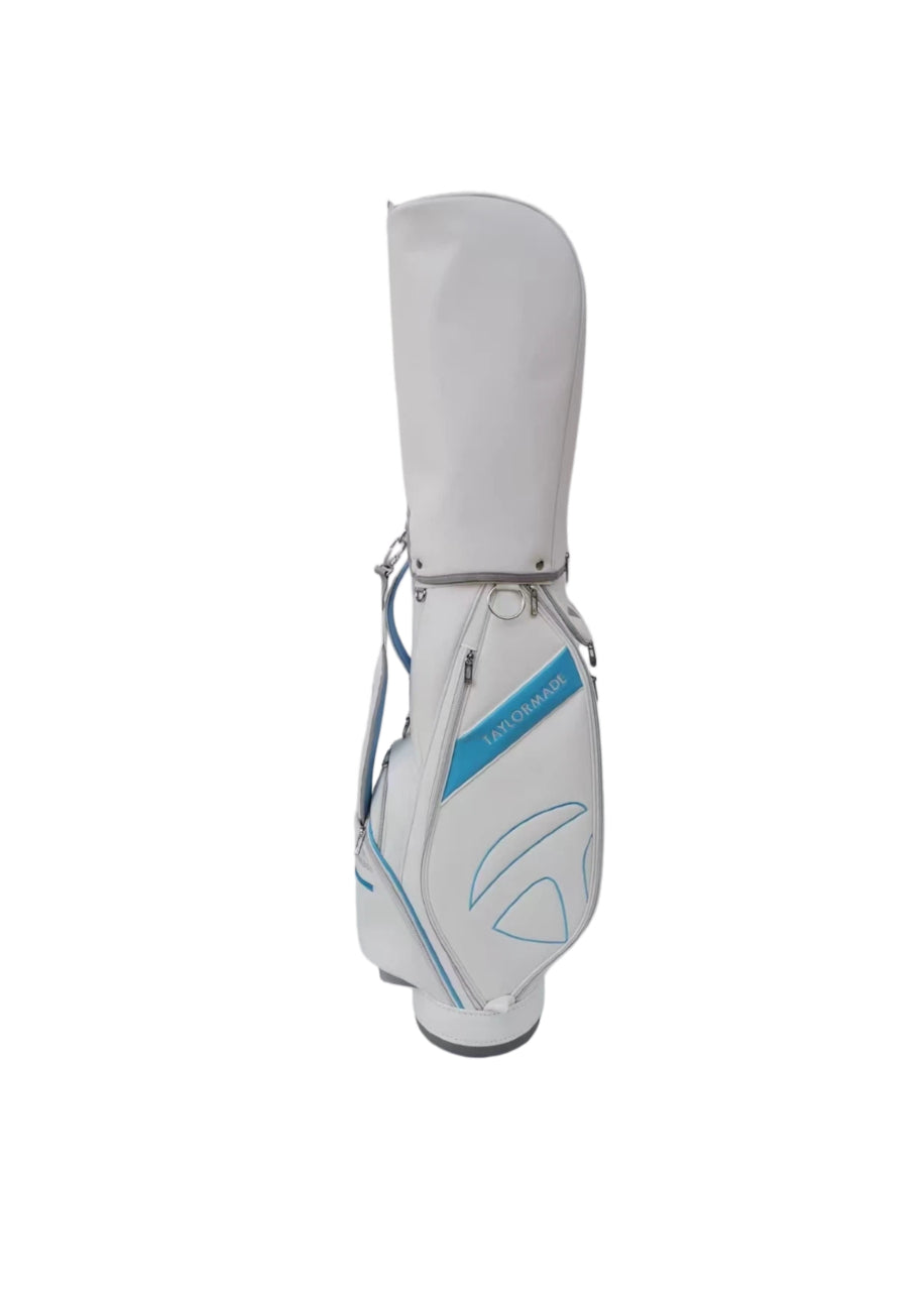 Front view of the TaylorMade Concept One golf cart bag in white with blue diagonal accent and clean logo placement. Built with high-quality synthetic materials, this lightweight bag includes a comfortable carry handle and multiple storage pockets for essential golf gear.