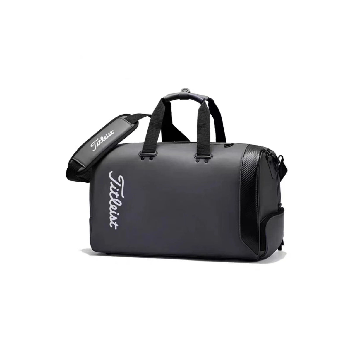 Front view of the all-black Titleist Tech Duffel with carbon fiber-style side panel and white "Titleist" script logo. Features top handles and a padded shoulder strap for comfortable carrying.
