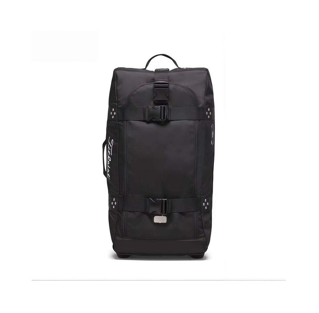 Front view of the black Titleist Club Rolling Duffle Bag featuring secure ITW Nexus buckles, top carry handle, side grip handles, and elegant white "Titleist" logo. Built for long-lasting performance and style.