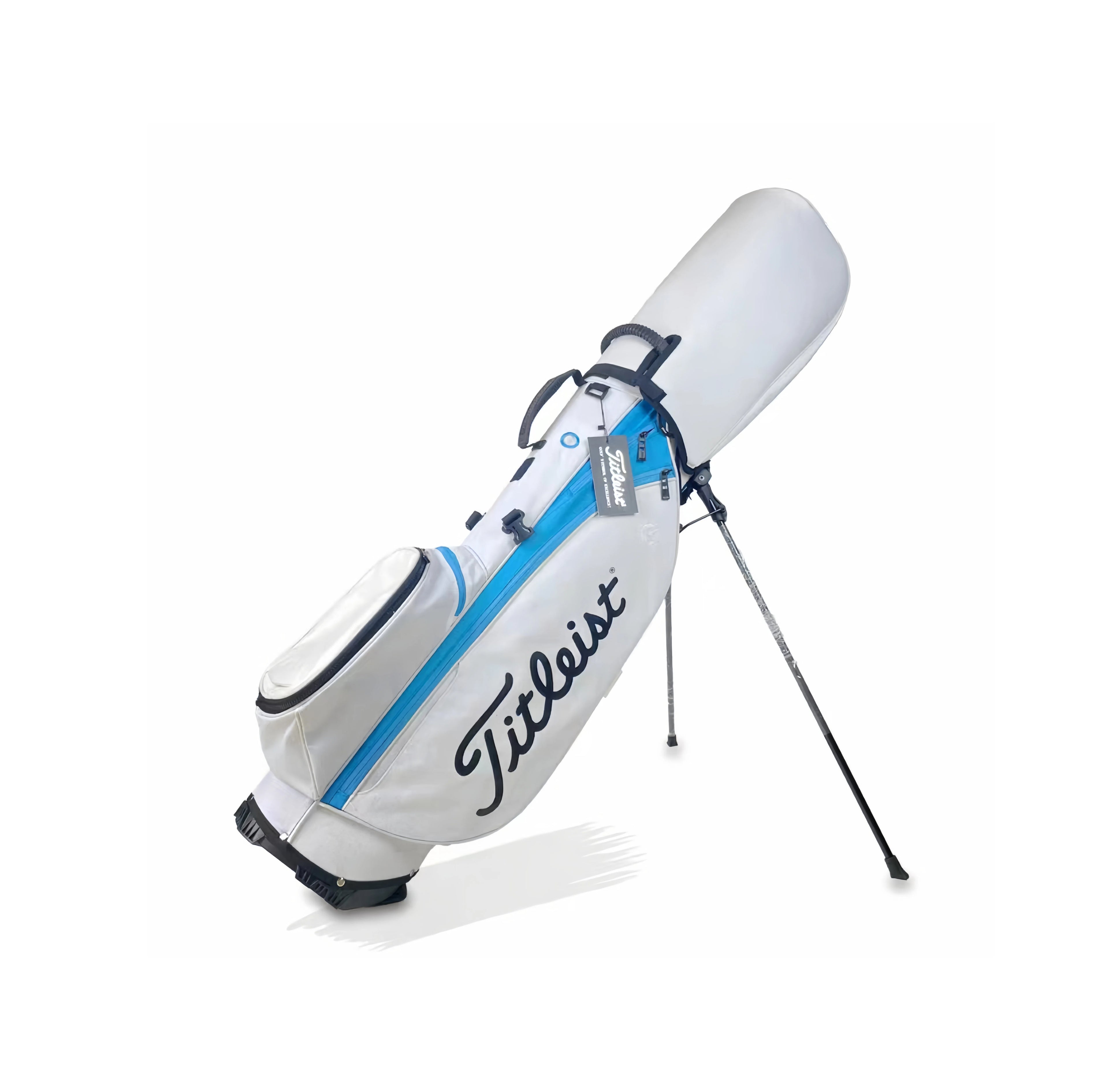Angled view of the white Titleist carry golf bag with blue trim and fully extended dual stand legs. Features a sleek design, zippered pockets, and durable fabric ideal for walking golfers.