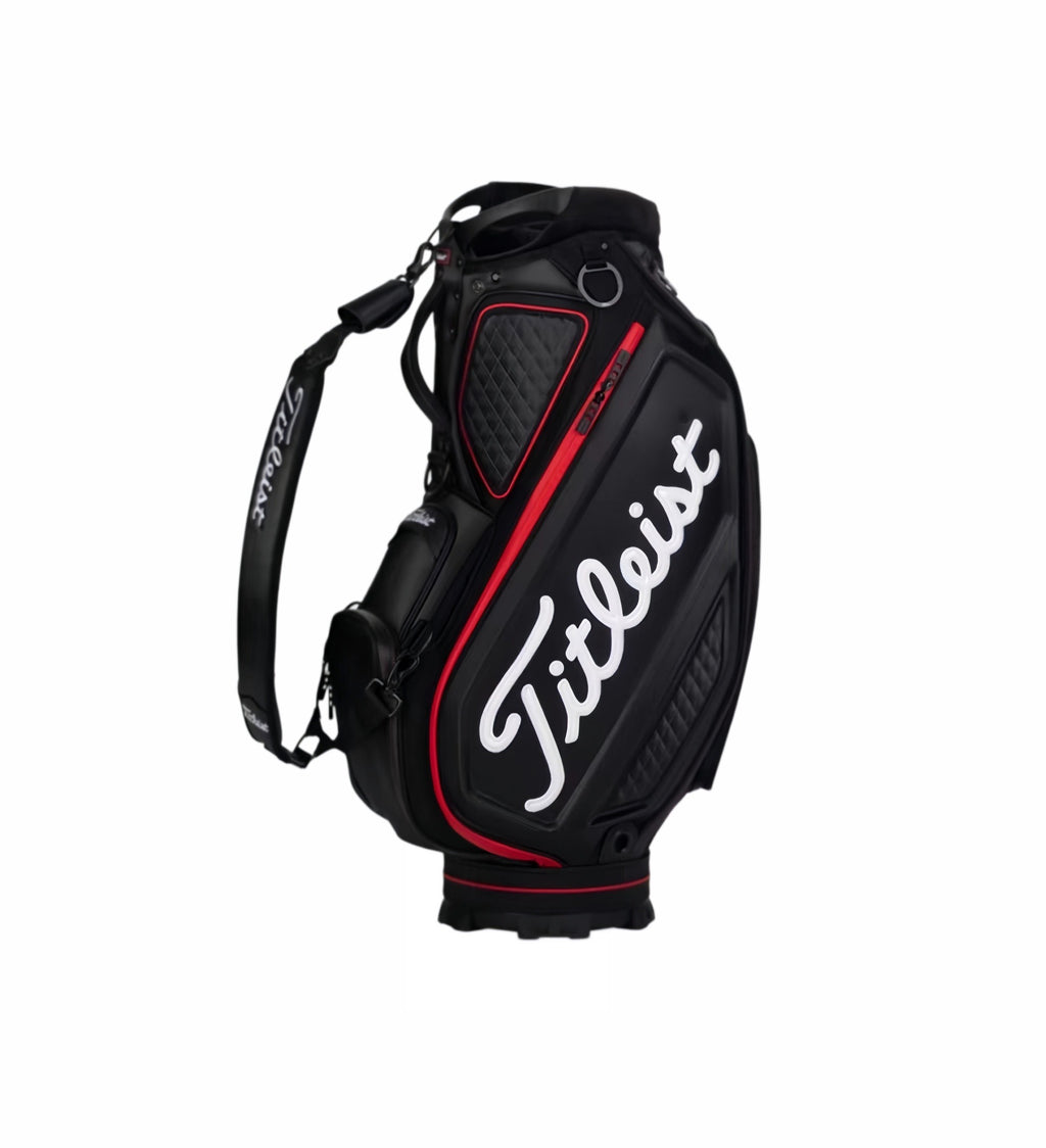 Top-down close-up of the Titleist Tour golf bag showing black and white panel design, padded carry handles, and quilted interior. Features a sleek, modern look with reinforced stitching and durable materials ideal for daily use.
