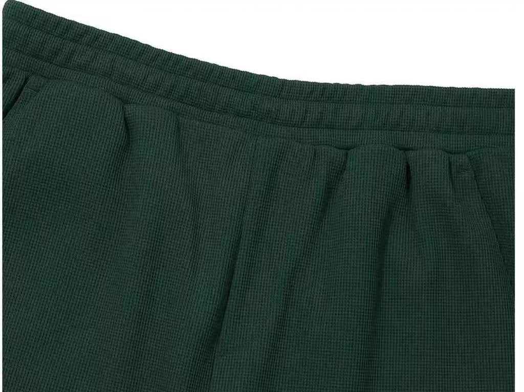 Malbon men's white golf shorts pocket detail