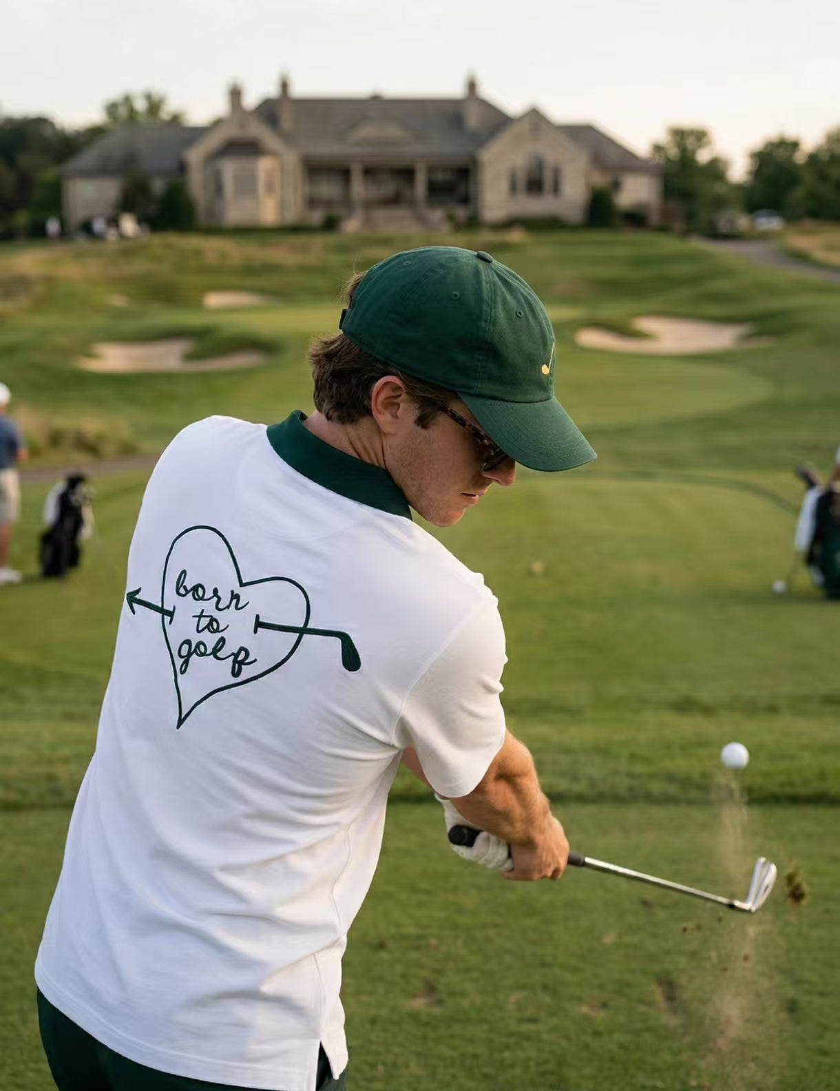 Devereux heart-print golf polo side view on male model