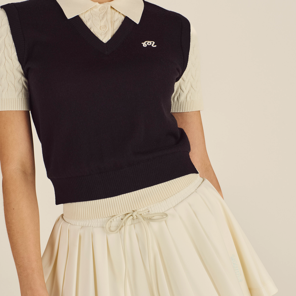 Malbon Veronica Polo Black Onyx Cream collar and branding detail